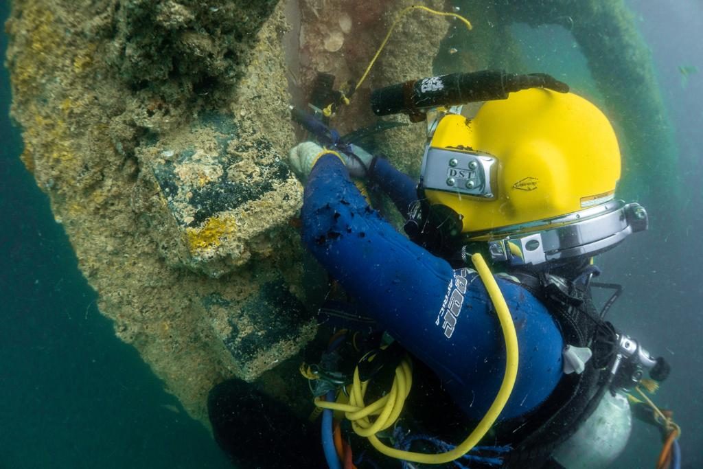 HDS diver carrying out in-water inspection and maintenance on a marine structure
