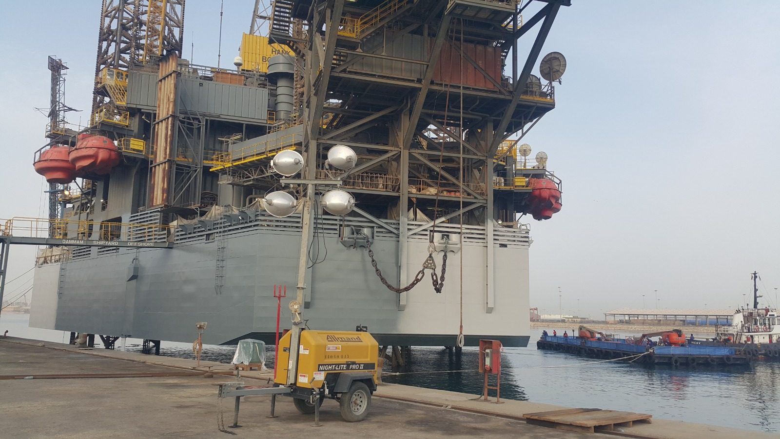 Jack-up rig alongside at Dammam Shipyard during HDS offshore support works